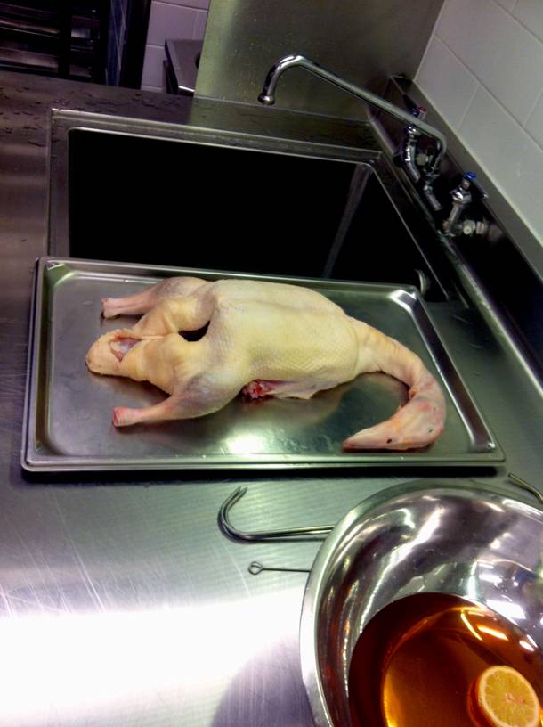 The before shot. Inside the kitchen at Hakkasan, this duck will be stuffed with kumquats, mustard, five-spice, soy sauce and more so that a rich, complex flavor infuses during the cooking process.